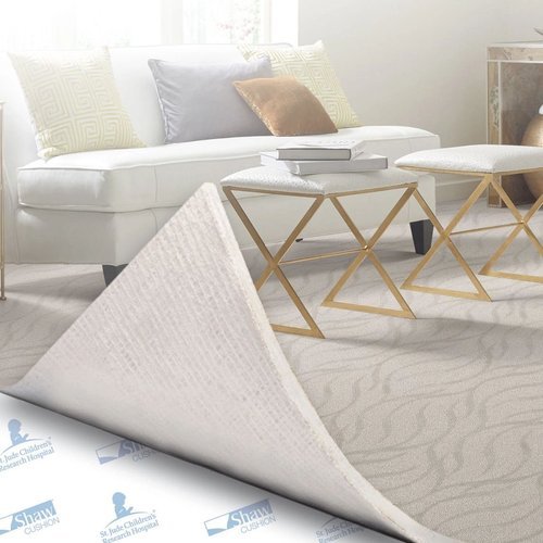 Carpet being peeled back to reveal the layer of cushioning underneath - Carpet cushion from Southwest Floors in Seven Hills, OH