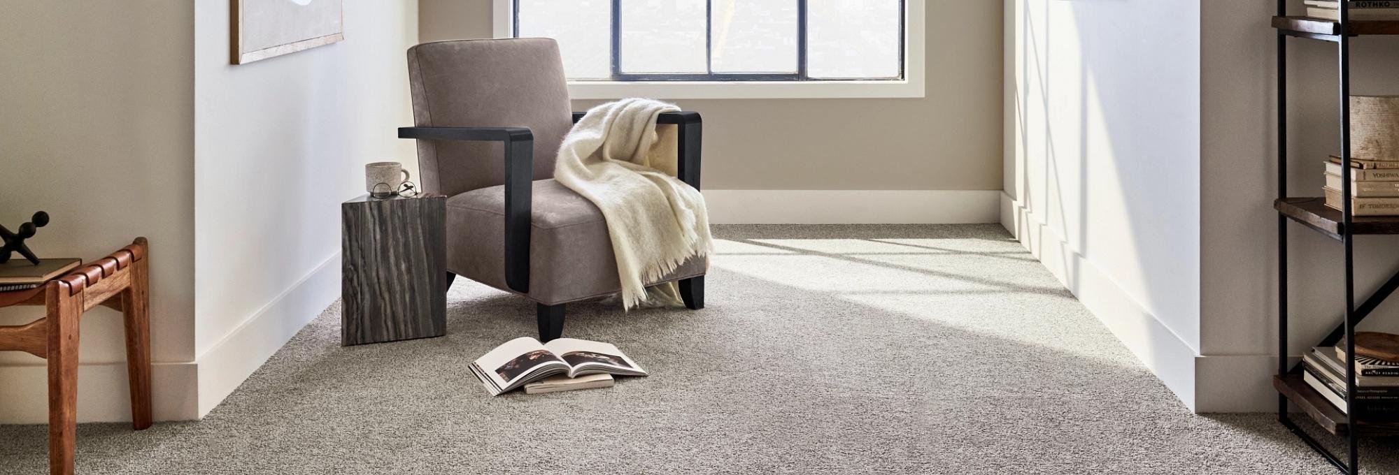 Room with a gray armchair in the window and gray carpet from Southwest Floors in Seven Hills, OH