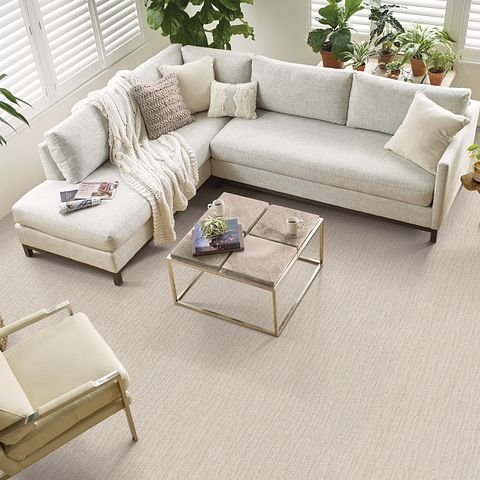 Photo of living room taken from above with corner sofa and beige carpet from Southwest Floors in Seven Hills, OH